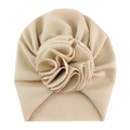 Detail of baby turban hat showing waffle knit fabric texture and 3D flower in beige - One Size / No. 3 Beige