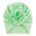 Detailed view of mint green waffle knit baby turban hat with a large handmade floral accent - One Size / No. 10 Mint Green