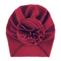 Detailed view of dark red knit baby turban featuring a large fabric flower embellishment - One Size / No. 13 Wine Red