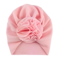 Close-up of pink waffle knit baby turban hat with a large decorative 3D flower detail - One Size / No. 18 Light Pink