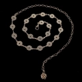 Close-up of gold chain belt with crystal-encrusted circles and rose charm - Gold Rhinestone Loop Rose (Style 10)
