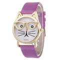 Close-up of cute purple cat-shaped watch face with golden metal case and quartz dial detail - Purple