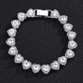 Close-up of a silver heart-shaped chain bracelet with zircon stones and full diamond inlay - 8 Inch (20cm) Bracelet / Silver
