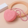 Detailed close-up of pink heart-shaped straw woven mini bag with delicate texture - Deep Pink