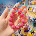 Pink beaded phone charm with a cute cartoon bear and bowknot pendant details - Rose Red