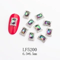Detailed macro of a 6.5x8.5mm iridescent rectangular nail art jewel with a silver frame - Silver Frame AB Color Rectangle Style (5200)