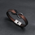 Brown leather bracelet with infinity symbol and stainless steel clasp on leather background - Brown