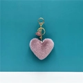 Detail of lavender heart plush keychain with gold lobster clasp and purple tassel charm - Purple