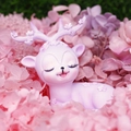 Pink and purple deer figurine with flower antlers lying on a dreamy floral background - 1008-3B Purple Floral Deer