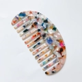 Semicircle acetate hair comb featuring a colorful terrazzo marble pattern on white background - Rainbow
