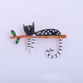 Cute black polka dot cat brooch on a branch with green leaves made of enamel alloy - YNCP3150 Black