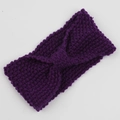 Detail of purple corn kernel knit headband featuring a bohemian twisted knot design - Deep purple