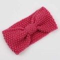 Detailed knit texture of a magenta bohemian headband with a centered decorative bow - Peach Pink