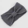 Close-up of a grey knitted headband with a stylish bohemian knot and bow design - Medium Grey