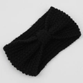 Detail of black corn kernel knit headband featuring a bohemian bowknot texture - Black