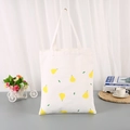 White canvas tote bag featuring a yellow pear print and long shoulder straps - Pear