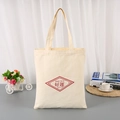 Minimalist beige canvas tote bag with Good Luck print and red diamond pattern details - Good Luck