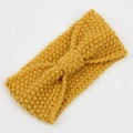 Detail of ginger yellow corn grain knitted headband with central bow design texture - Ginger Yellow