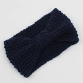 Detail of navy blue knitted headband featuring chunky corn kernel texture and bow design - Navy Blue