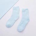 Light blue coral fleece sleeping socks for women with cozy thick plush texture on white background - Mint Green