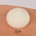 Single 7cm realistic squishy steamed bun toy on wooden board with clear pleat textures - 7cm Large Sharp Bun Squishy