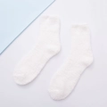 Soft white coral fleece sleeping socks for women featuring a thick plush texture - Cream
