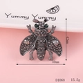Detail of bee alloy accessory with green gemstone eyes and rhinestones, 40mm x 42mm size - D1068 Black Bee