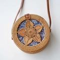 Handmade round rattan shoulder bag featuring a blue floral lining and leather strap - Natural-Five Leaf Bag