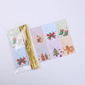 Detail view of assorted Christmas gift tags featuring snowman and tree motifs with gold ties - Gift Tag 6 Styles (30pcs Set)