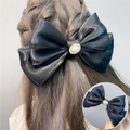 Elegant large double-layer black bow hair clip with oval pearl center in satin finish - Spring Clips / Black