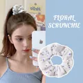 Blue floral scrunchie in white textured fabric, elastic hair tie for women and girls - Blue Floral
