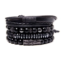 Detail of multi-layered men's bracelet with black beads, woven leather and carved metal - Black Spacer Combination