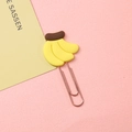 Creative banana shaped paper clip with rose gold metal finish and yellow silicone accent - Three Bananas