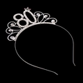 Close-up of number 80 tiara with sparkling rhinestones and pink gemstone detail - Number 80
