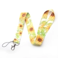 Close-up of fabric lanyard with yellow sunflower pattern and silver swivel lobster clasp - AL2809 Yellow Sunflower Lanyard