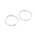 Minimalist rose gold stainless steel hoop earrings with a decorative knot detail - 40mm / Rose Gold