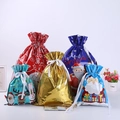 Assorted colorful drawstring Christmas foil gift bags in various sizes with Merry Christmas print - 5 Designs 6pcs Each (Set of 30)