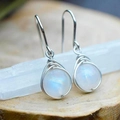 Artistic handmade wire-wrapped moonstone drop earrings with a blue glow and silver finish - Moonstone Wire Wrapped / White