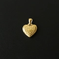 Macro detail of a 18K gold-plated heart pendant with fine vintage engraved carvings - M10 Patterned Heart