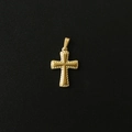 Close-up of 18K gold-plated titanium steel cross pendant with embossed texture on black background - M04 Beaded Cross
