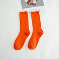 Vibrant orange cotton crew socks featuring a classic ribbed texture and comfortable fit - Orange
