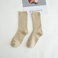 Beige ribbed cotton mid-calf socks laid flat on a white fabric background - Khaki