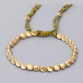 Handmade woven bracelet with twisted golden metal beads and adjustable cord tassels - Yellow + Coffee