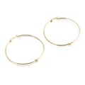 Large golden stainless steel hoop earrings with minimalist knot detail for women - 50mm / Gold