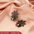 Detail of gothic spider web earrings with colorful rhinestones on silk background - Black Spider Web Style