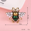 Detail of bee brooch with pearls, green enamel, and black crystals in antique gold finish - D1146 Dark Green Bee Large