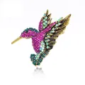 Elegant hummingbird brooch with colorful pink and green crystals on gold-tone metal base - Purple Rhinestone Gold Base