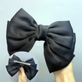 Elegant large black satin ribbon bow hair clip featuring a secure metal spring fastener - Duckbill Hair Clips / Black