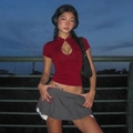 Close-up of dark red short top featuring a teardrop cutout and elegant buckle detail - S / Burgundy