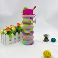 Detail view of foldable silicone sports bottle with tie-dye pattern and metal carabiner - 500ml / Camo Pink (Flip Lid)